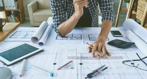Cropped,Image,Of,Architect,Working,With,Construction,Plans